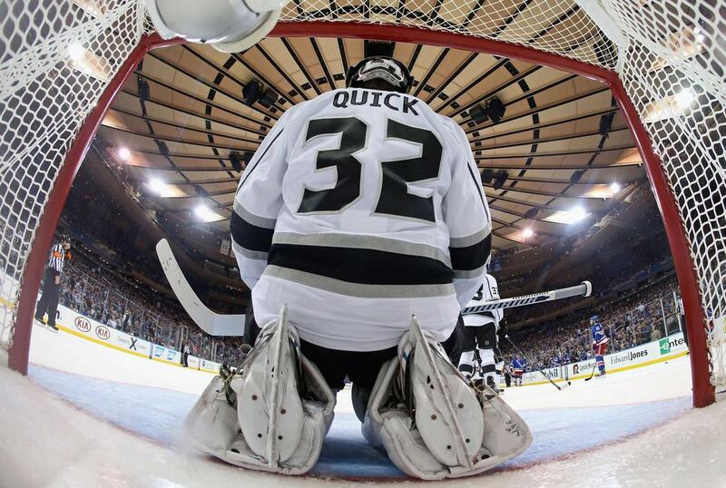 Los Angeles Kings goaltender Jonathan Quick kneels in the net during the second period of the Kings’ 3-0 win over the New York Rangers in the Stanley Cup Finals on Monday. Bruce Bennett / AFP


