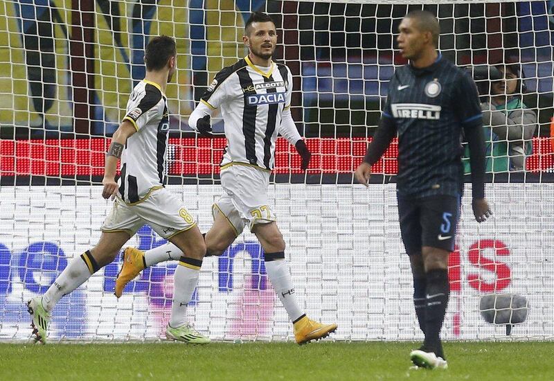 Udinese's Cyril Thereau, centre, celebrates after scoring the eventual winner in his side's 2-1 Serie A victory over Inter Milan on Sunday. Alessandro Garofalo / Reuters / December 7, 2014 