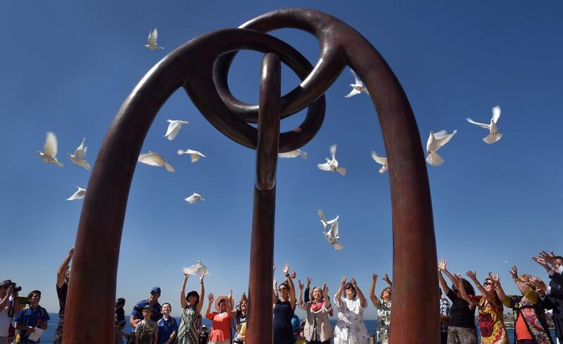 People release 88 doves as political leaders and families of victims of the Bali bombings gather on Sydney’s Coogee Beach on October 12, 2015. William West / AFP Photo