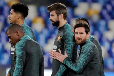 Soccer Football - Champions League - FC Barcelona Training - Stadio San Paolo, Naples, Italy - February 24, 2020 Barcelona's Lionel Messi, Gerard Pique and teammates during training REUTERS/Ciro De Luca