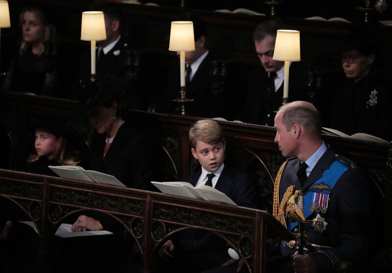 Prince George looks towards his father Prince William during the Committal Service at St George's Chapel. Getty Images