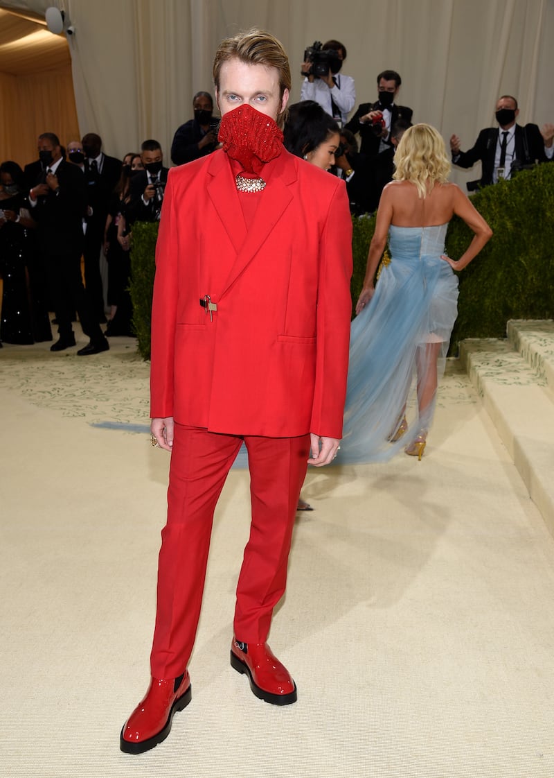 Finneas wears red Givenchy to the 2021 Met Gala. AP