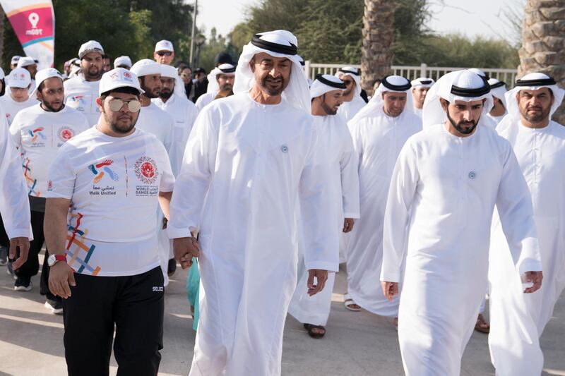 ABU DHABI, UNITED ARAB EMIRATES - January 26, 2018: HH Sheikh Mohamed bin Zayed Al Nahyan, Crown Prince of Abu Dhabi and Deputy Supreme Commander of the UAE Armed Forces (2nd L) and HH Sheikh Hamdan bin Mohamed Al Maktoum, Crown Prince of Dubai (2nd R), participate in the Special Olympics Wold Games Abu Dhabi 2019 initiative "Walk Unified", at Umm Al Emarat Park.

( Hamad Al Kaabi / Crown Prince Court - Abu Dhabi )
—