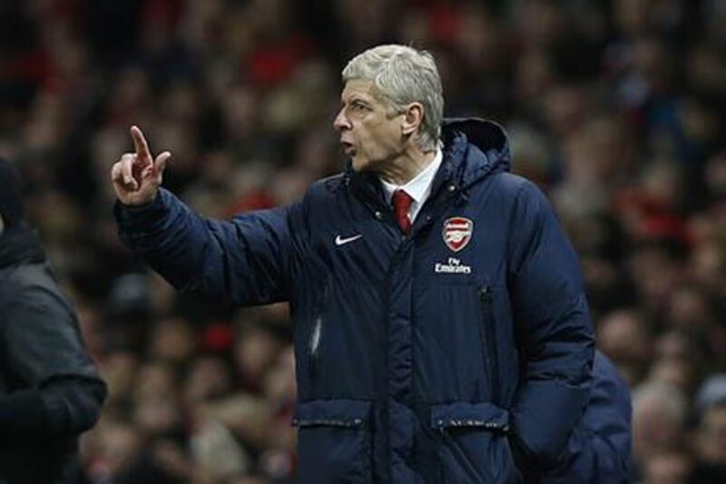 Arsene Wenger's side have excelled on a balanced budget all season. Sang Tan / AP Photo