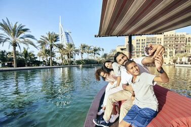 Tourists take an Abra ride through Dubai's Madinat Jumeirah resort. Dubai hotels recorded occupancy rates of 60.5 per cent in March, up from 58.2 per cent in February, according to STR. Courtesy: Dubai Tourism. 