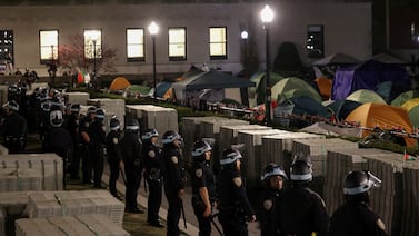 Police stand guard near a camp of protesters supporting Palestinians on the grounds of Columbia University. Reuters