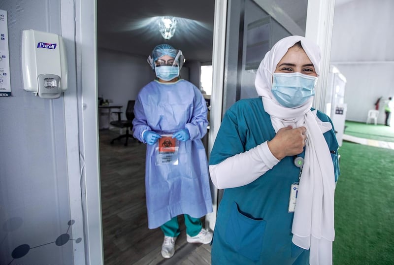 Dubai, United Arab Emirates, April 12, 2020.  The National Screening Center, Mina Rashed, Dubai.  Nurses smile for the camera.
Victor Besa / The National
Section:  NA
Reporter:  Nick Webster