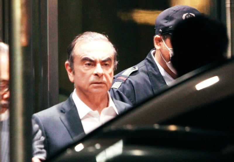 FILE - In this April 25, 2019, former Nissan Chairman Carlos Ghosn leaves the Tokyo Detention Center in Tokyo. A Japanese court has turned down an appeal from the lawyers of Ghosn over his bail conditions that limit his contact with his wife. Kyodo News service reported Thursday the Tokyo District Court rejected the appeal filed earlier in the day. (AP Photo/Eugene Hoshiko, File)