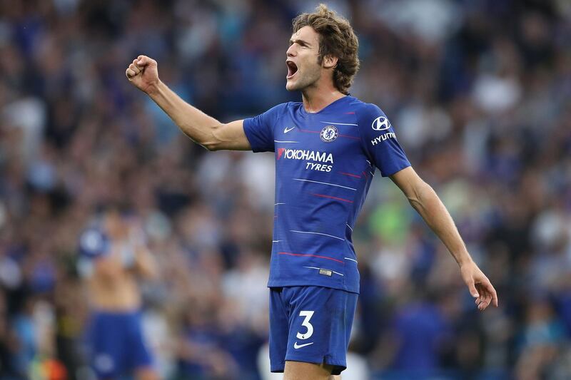 Chelsea's Spanish defender Marcos Alonso celebrates on the final whistle in the English Premier League football match between Chelsea and Arsenal at Stamford Bridge in London on August 18, 2018. - Chelsea won the game 3-2. (Photo by Daniel LEAL-OLIVAS / AFP) / RESTRICTED TO EDITORIAL USE. No use with unauthorized audio, video, data, fixture lists, club/league logos or 'live' services. Online in-match use limited to 120 images. An additional 40 images may be used in extra time. No video emulation. Social media in-match use limited to 120 images. An additional 40 images may be used in extra time. No use in betting publications, games or single club/league/player publications. / 