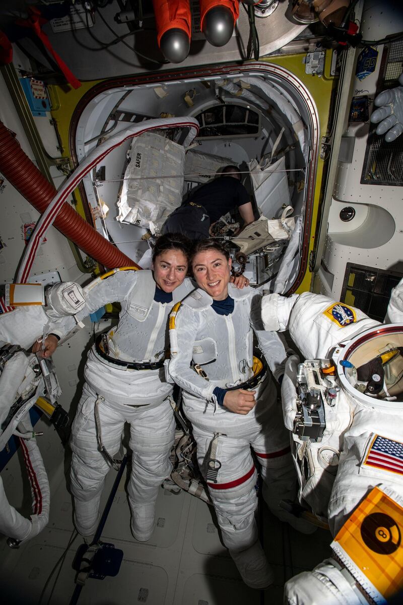 NASA astronauts Jessica Meir (left) and Christina Koch (right) put on their spacesuits as they prepare to leave the hatch of the International Space Station and begin the historical first-ever all-female spacewalk. The two ventured outside the International Space Station on Friday, Oct. 18, to replace faulty equipment on the station’s exterior. The astronauts replaced a faulty battery charge/discharge unit (BCDU) that failed to activate following the Oct. 11 installation of new lithium-ion batteries on the space station’s exterior structure. The BCDUs regulate the amount of charge put into the batteries that collect energy from the station’s solar arrays to power station systems during periods when the station orbits during nighttime passes around Earth. Though the BCDU failure has not impacted station operations or crew safety, it does prevent the new batteries from providing increased station power. Courtesy NASA