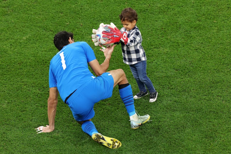 Goalkeeper Yassine Bounou's son wears his dad's gloves. Getty