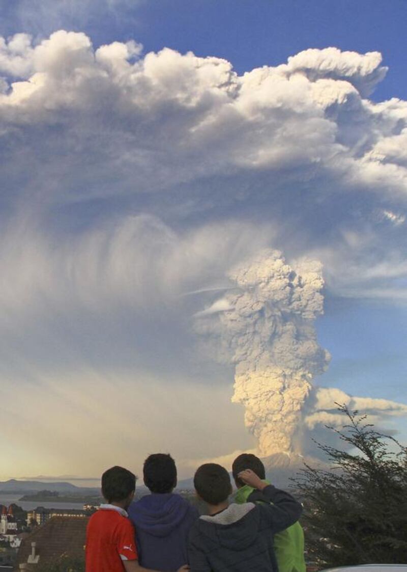 Children watch the Calbuco volcano erupt. Carlos F Gutierrez / AP Photo
