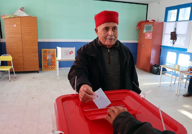 A voter casts his ballot during the first round of the Tunisian parliamentary elections at a polling station in Tunis. EPA