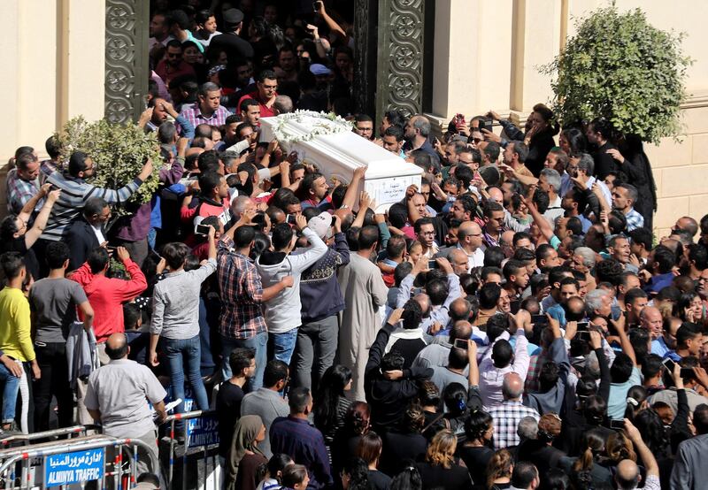 Mourners carry a coffin during the funeral of Coptic Christians who were killed in an attack, in Minya, Egypt November 3, 2018. REUTERS/Mohamed Abd El Ghany