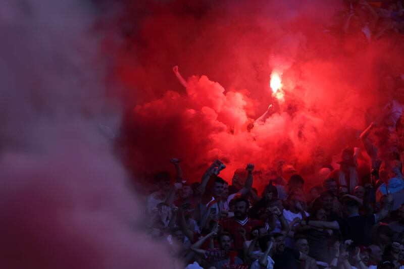 Liverpool fans celebrate at Wembley Stadium. AP