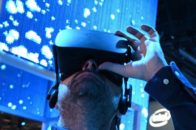 An attendee wears a Genius VR headset at the Intel booth during CES 2019 consumer electronics show at the Las Vegas Convention Center in Las Vegas, Nevada, USA. AFP