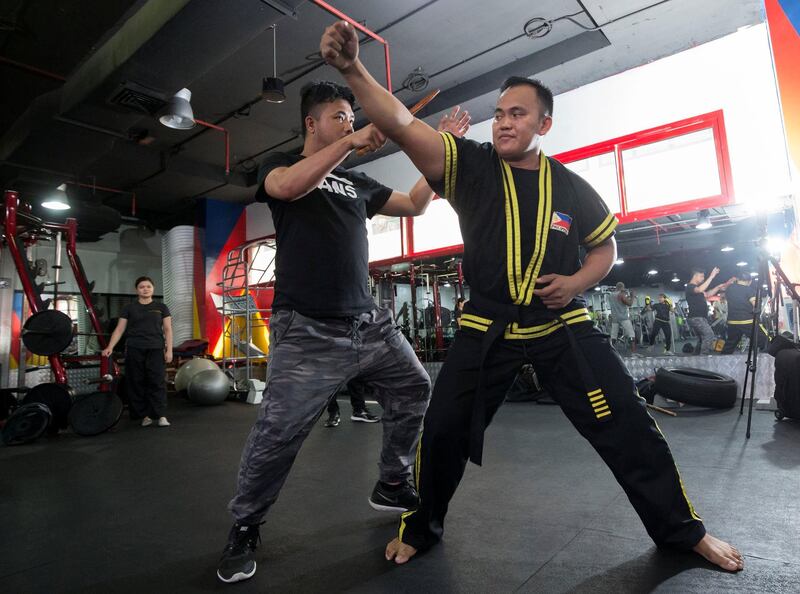 Dubai UNITED ARAB EMIRATES - Guro Omar , a Filipino eskrima giving instructions to his students at Power Gym in Dubai.  Ruel Pableo for The National for Nick's story