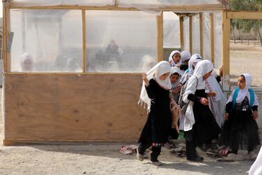 Afghan girls of up to primary grades leave a class at their school in Kandahar, Afghanistan, 23 March 2022.   The Taliban on 23 March barred girls of grades seven to 12 from attending schools pending a decision on their uniform designs according to Islamic law, in a sudden departure from their earlier announcement that all Afghan females would be allowed to attend classes this week.  Allowing girls of all ages to attend schools has been one of the most crucial demands set by the international community after the Taliban, came to power.   EPA / STRINGER