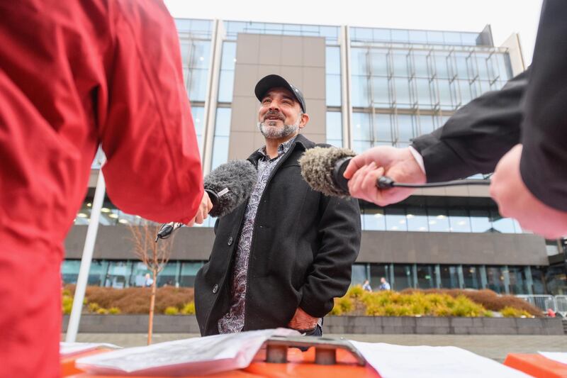 Yama Nabi, whose father Daoud Nabi was killed at Al Noor Mosque, speaks to the media in front of Christchurch High Court. Getty Images