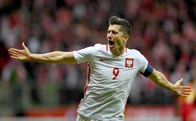 (FILES) In this file photo taken on October 8, 2017, Poland's forward Robert Lewandowski reacts after he scored a goal during the FIFA World Cup 2018 qualification football match between Poland and Montenegro in Warsaw. / AFP / JANEK SKARZYNSKI
