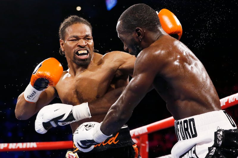 Shawn Porter, left, fights Terence Crawford. AP Photo