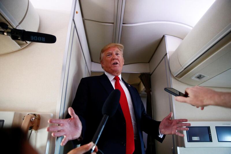 U.S. President Donald Trump speaks to the press aboard Air Force One en route to Bedminster, New Jersey, from Joint Base Andrews, Maryland, U.S., June 29, 2018. REUTERS/Eric Thayer