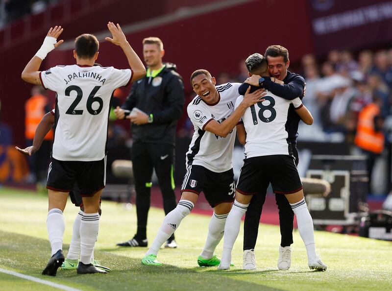 Andreas Pereira celebrates scoring for Fulham with manager Marco Silva and Carlos Vinicius. Reuters