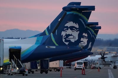 An Alaska Airlines flight made an emergency landing in Oregon after a window and chunk of its fuselage blew out in mid-air. AP