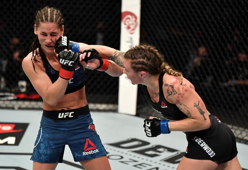 ABU DHABI, UNITED ARAB EMIRATES - JANUARY 23: (R-L) Joanne Calderwood of Scotland punches Jessica Eye in a flyweight fight during the UFC 257 event inside Etihad Arena on UFC Fight Island on January 23, 2021 in Abu Dhabi, United Arab Emirates. (Photo by Jeff Bottari/Zuffa LLC)
