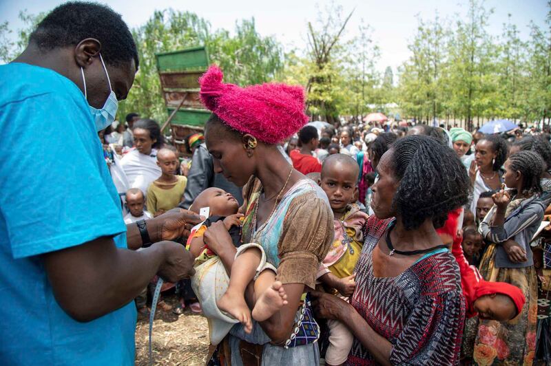 UN aid workers screen children for malnutrition in Tigray. Unicef via AP