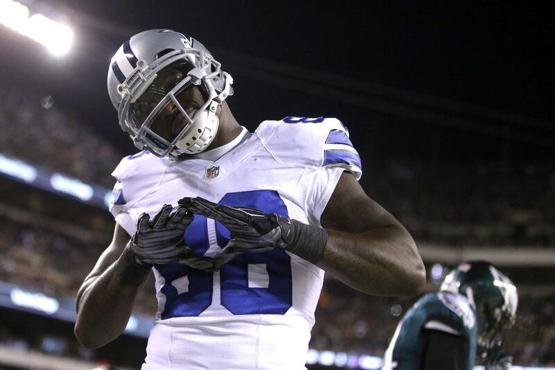 Dez Bryant of the Dallas Cowboys reacts after scoring a touchdown on Sunday in his team's NFL win over the Philadelphia Eagles. Matt Rourke / AP / December 14, 2014