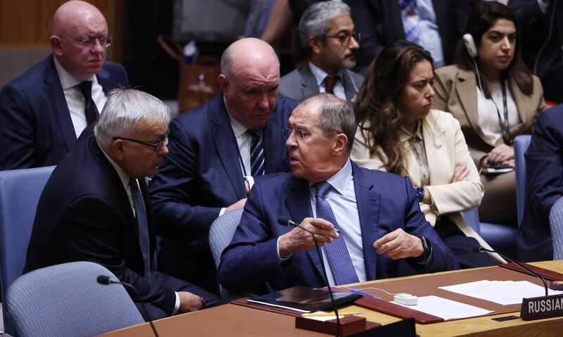 Mr Lavrov and Russian deputy foreign minister Sergey Vershinin, left, confer during the Security Council meeting on Ukraine. EPA