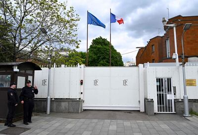 Police officers stand guard at the French embassy in Moscow. AFP