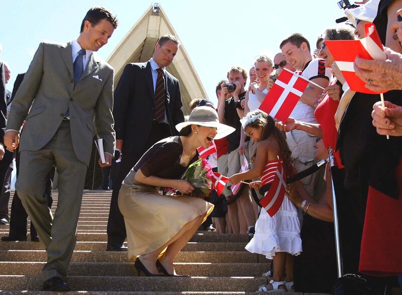 The royal couple greet people on the steps of the Sydney Opera House in Australia in 2005. AP