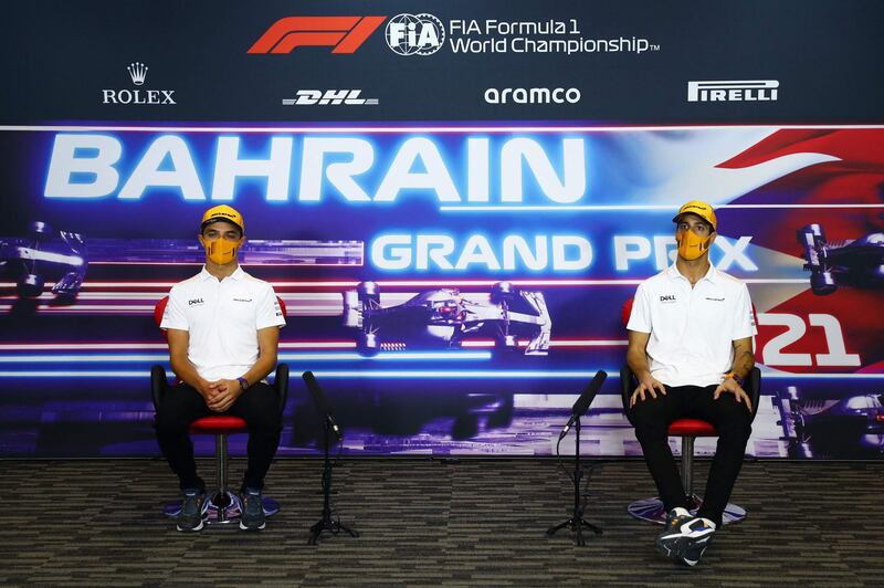 McLaren's British driver Lando Norris and McLaren's Australian driver Daniel Ricciardo talk to the press before the F1 Grand Prix of Bahrain. AFP