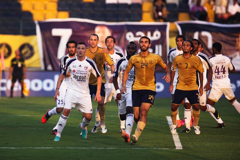 Dubai, UAE, October 10, 2012:

Al Ain went into Dubai's home stadium and properly dismantled the team. After ending the first half 1-1 Al Ain came back to win 4-1. THe tide was turned after a player from the Dubai club received a red card on a goal kick.

Al Ain (white) and Dubai (yellow) players wait for the ball to come down on a corner kick.


Lee Hoagland/The National