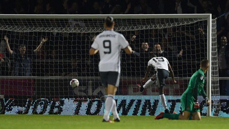 Manchester United striker Marcus Rashford, second right, scores his team’s third goal. Ben Stansall / AFP