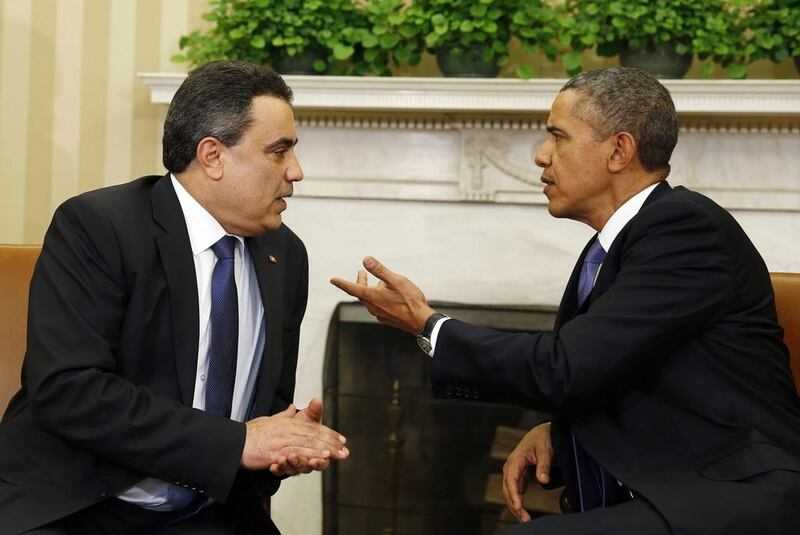 Barack Obama and Tunisia's prime minister Mehdi Jomaa in the Oval Office. Mr Jomaa was the first Tunisian leader to visit Washington since 1990.  Larry Downing / Reuters / April 4, 2014 