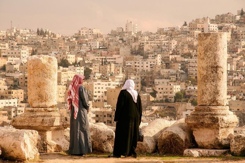 A Jordanian Couple views the Jordanian capital of Amman from the Hill of the Citadel, or Jabal al-Qal'a.
