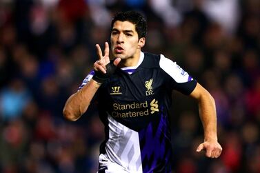 STOKE ON TRENT, ENGLAND - JANUARY 12: Luis Suarez of Liverpool celebrates as he scores their second goal during the Barclays Premier League match between Stoke City and Liverpool at Britannia Stadium on January 12, 2014 in Stoke on Trent, England. (Photo by Clive Mason/Getty Images)