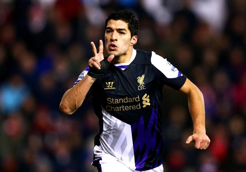 STOKE ON TRENT, ENGLAND - JANUARY 12:  Luis Suarez of Liverpool celebrates as he scores their second goal during the Barclays Premier League match between Stoke City and Liverpool at Britannia Stadium on January 12, 2014 in Stoke on Trent, England.  (Photo by Clive Mason/Getty Images)