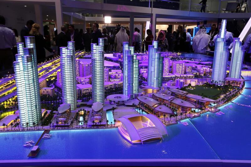 Dubai Properties' Culture Village project, sized down to scale, is bathed in light at the Cityscape Global. Pawan Singh / The National