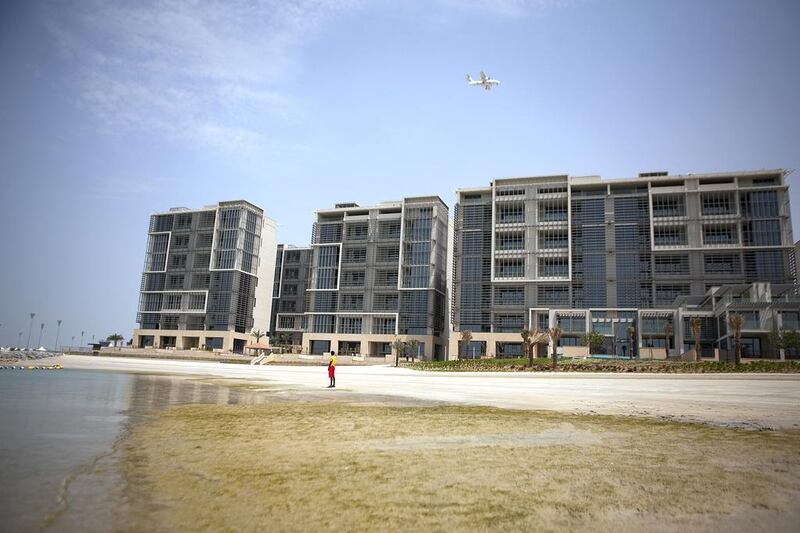 Al Raha Beach apartments: Q2 up 4%. 1BR: Dh100-120,000. 2BR: Dh135-165,000. Dh180-240,000. Q2 2013-Q2 2014 up 6%. Silvia Razgova / The National