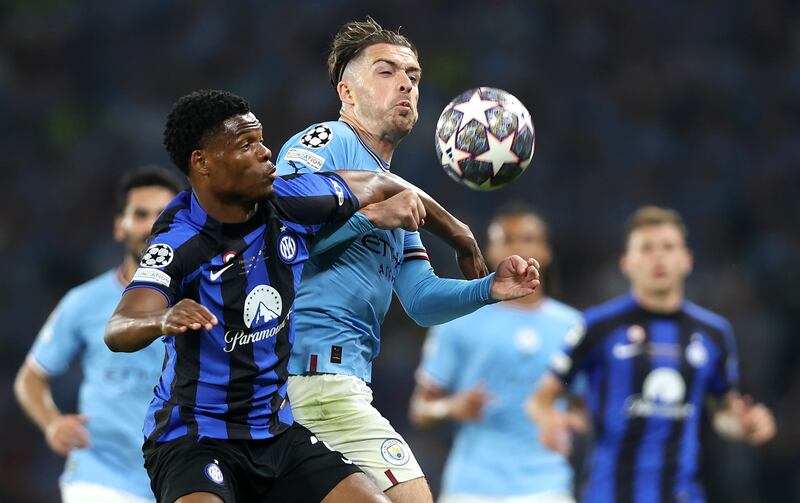 Jack Grealish of Manchester City and Denzel Dumfries of Inter fight for the ball. EPA