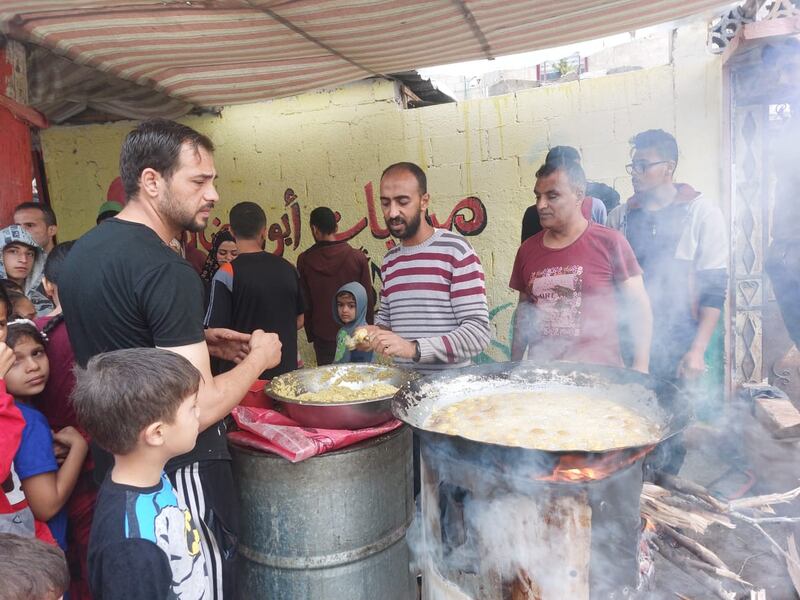 Mohammed Ramadan’s falafel cart, set up near shelters for displaced Palestinians in Gaza, has become a popular spot. Mohamed Solaimane for The National