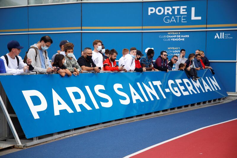 Supporters wait outside Paris Saint-Germain's Parc des Princes stadium.