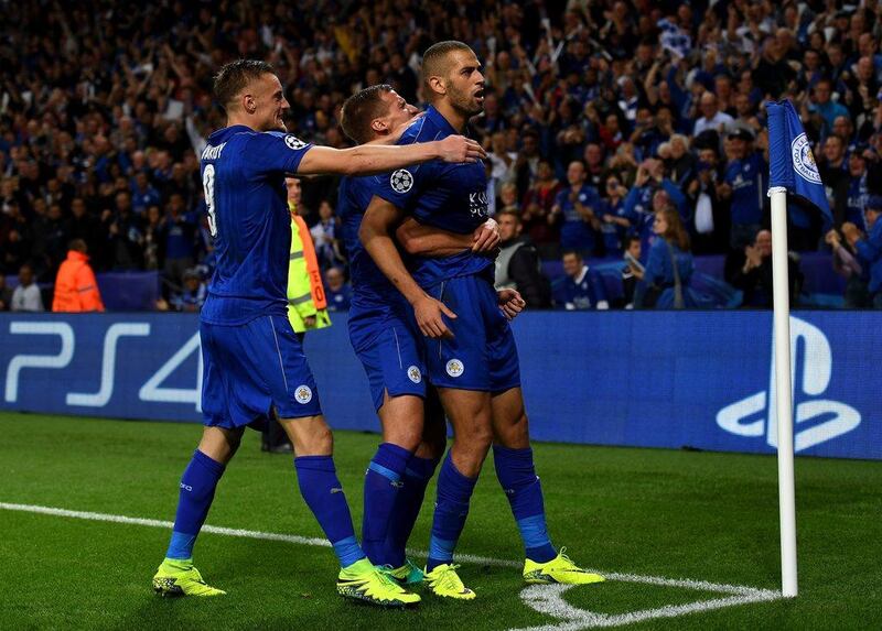 Islam Slimani of Leicester City, right, celebrates with teammates after scoring in the Champions League Group G match. Shaun Botterill / Getty Images