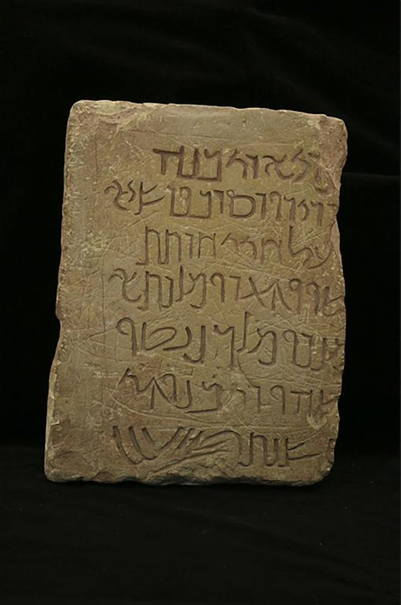 A limestone found in Az-Zantur in Petra with Nabataean script, from which Arabic script was born. The text mentions a cavalry leader who erected a building for the King Aretas IV and gives the date : February of year AD 10. The stone is on display at The Sharjah Archaeology Museum under the Exhibition: Petra, Desert Wonder until March 16, 2017.  Courtesy of Sharjah Museums Department