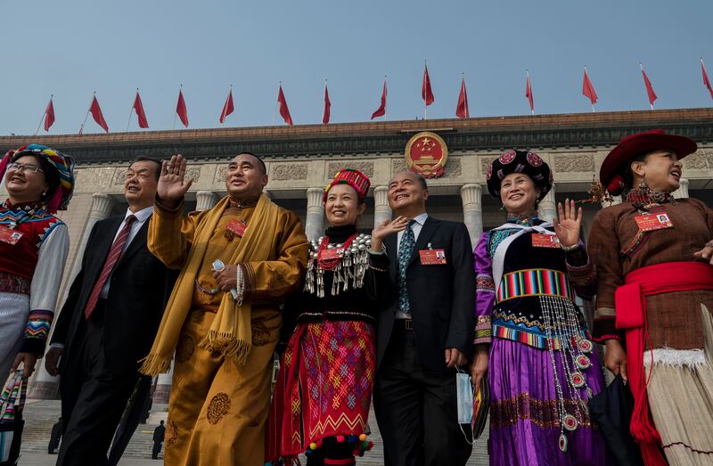 BEIJING, CHINA - MARCH 10: Delegates, some dressed in traditional clothing from different ethnic groups, gather for photos after the closing session of the Chinese People's Political Consultative Conference (CPPCC) at the Great Hall of the People on March 10, 2022 in Beijing, China. China's week-long annual political gathering, known as the Two Sessions, convenes the nation's leaders and lawmakers to set the government's agenda for domestic economic and social development for the next year. (Photo by Kevin Frayer / Getty Images)