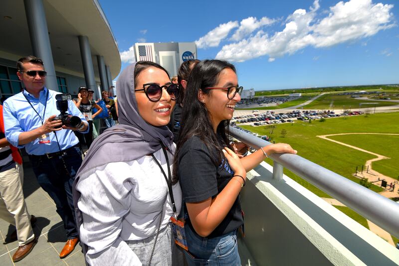 Alia Al Mansoori watches with her sister Maryam Al Mansoori as a SpaceX Falcon 9 rocket launch from Kennedy Space Center carrying her Genes in Space experiment to the International Space Station on Aug. 14, 2017 in {town}, Florida. 
(Scott A. Miller for The National)